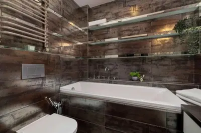 a bathroom with a white tub and a toilet at Meiera Krakow Charming Apartment with Parking and Air Conditioning by Noclegi Renters in Kraków