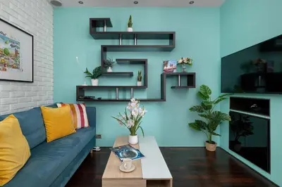 a living room with a blue couch and a table at Meiera Krakow Charming Apartment with Parking and Air Conditioning by Noclegi Renters in Kraków