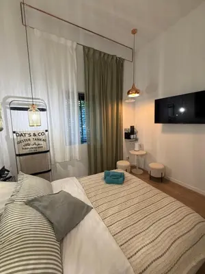 a bedroom with a large bed in a room at Green Harmony Apartment in Kraków