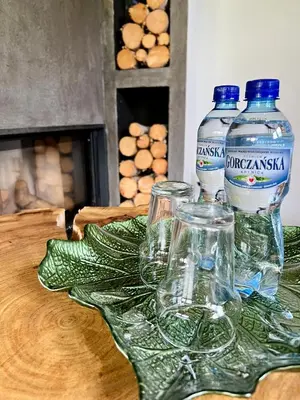 a group of bottles and glasses sitting on a table at Gorczańska Przystań in Zasadne