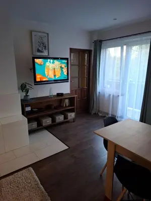 a living room with a couch and a table at Apartamenty TUTERRA IV in Zabagnie