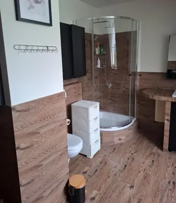 a bedroom with a bed and a large mirror at Apartamenty TUTERRA IV in Zabagnie