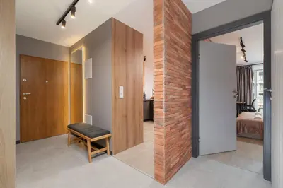 a room with a door leading to a bedroom at Elegant & Bright Apartment Zabłocie by Renters Prestige in Kraków