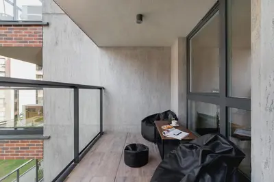 a balcony with a table and a window at Elegant & Bright Apartment Zabłocie by Renters Prestige in Kraków