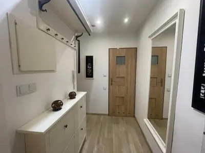 a bathroom with a sink and a mirror at Szlak Home in Kraków