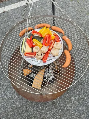 a plate of hot dogs and vegetables on a table at Domek na Krakowskiej in Kęty