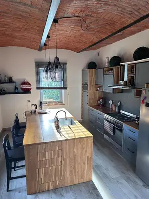 a kitchen with a large island in the middle at Domek na Krakowskiej in Kęty