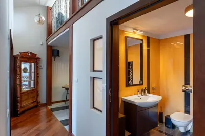 a bathroom with a sink and a mirror at Dome View Apartment by the Main Square - by Upstairs in Kraków