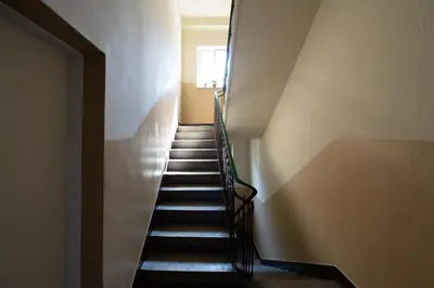 a stairway leading up to the top of a building at Dome View Apartment by the Main Square - by Upstairs in Kraków