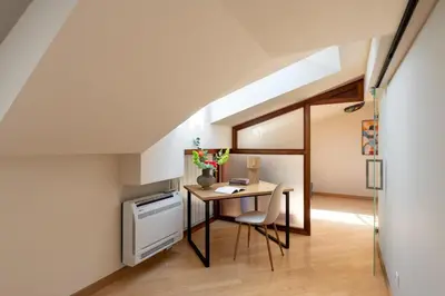 a kitchen with a table and a desk in a room at Dome View Apartment by the Main Square - by Upstairs in Kraków