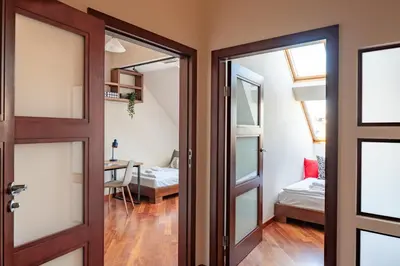 an open door to a room with a bedroom at Dome View Apartment by the Main Square - by Upstairs in Kraków