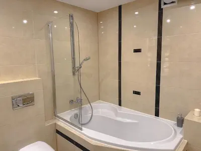 a bathroom with a shower and a bath tub at Fabryczna City Residence 100m2 Balcony by Gio Loft in Kraków