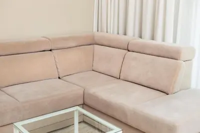 a brown couch with a coffee table in a room at City of the Kings - Solaris Apartment in Kraków