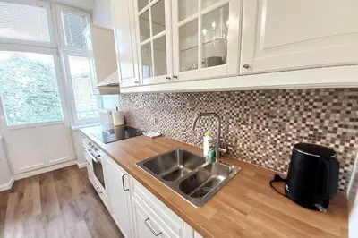 a kitchen with a sink and a counter top at Krakowska Street Old Town Apt 16 in Kraków