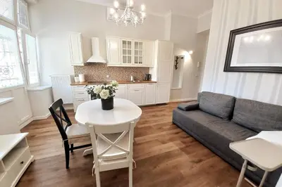 a living room with a couch and a table at Krakowska Street Old Town Apt 16 in Kraków