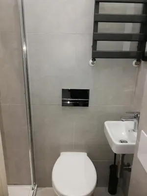 a bathroom with a toilet and a sink at 3D Royal Castle Apartament in Kraków