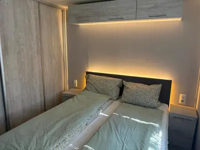 a bed with two pillows on it in a bedroom at Korzkiewka in Korzkiew