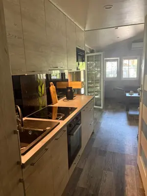 a kitchen with a sink and a stove top oven at Korzkiewka in Korzkiew
