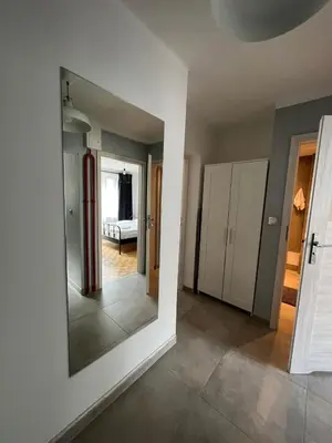a room with a mirror and a room with a bedroom at Main Square Apartment- Tomasza Street in Kraków