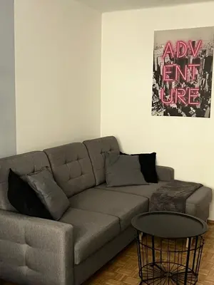 a living room with a couch and a table at Main Square Apartment- Tomasza Street in Kraków