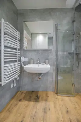 a bathroom with a sink and a shower at Sun & Garden House in Oświęcim