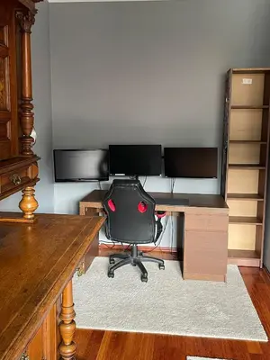 an office with a desk with a chair and a computer at Dodo Acomodo 9 in Kraków