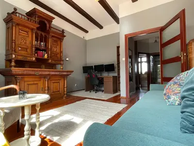 a living room with a couch and a table at Dodo Acomodo 9 in Kraków