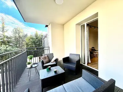 a bedroom with a brick wall and a bed at Urban Loft with Terrace - Design Apartaments in Kraków