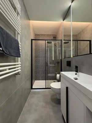 a bedroom with a bed and a couch at Comfort Cube - Design Apartaments in Kraków
