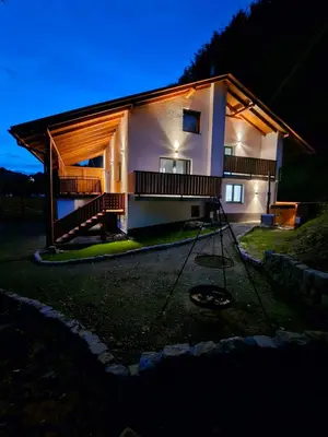 a house at night with a swing in the yard at Chata Pod Skarpą in Wieprzec