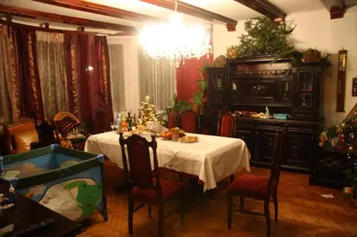 a dining room with a table with a christmas tree on it at A BEAUTIFUL HOUSE near AIRPORT KRAKOW-BALICE