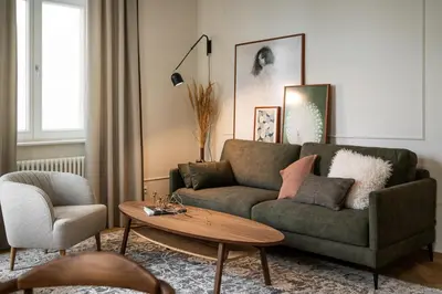 a living room with a couch and a coffee table at Noble Apartment in Kraków