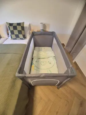 a suitcase with a face inside of it on a floor at Airport Lux Balice in Szczyglice