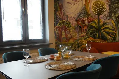 a table in a restaurant with wine glasses on it at Smoleńsk 33 Luxury Apartment in Kraków