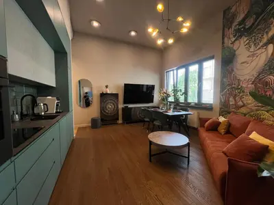 a living room with a couch and a table at Smoleńsk 33 Luxury Apartment in Kraków