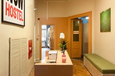 a living room with a couch and a table at WOW Hostel in Kraków