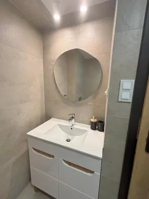 a bathroom with a white sink and a mirror at Apartament pod lasem 2 - przy szlaku na Turbacz, w pobliżu wyciągów narciarskich in Nowy Targ