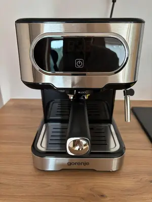 a black and silver coffee maker sitting on a table at Apartament pod lasem 2 - przy szlaku na Turbacz, w pobliżu wyciągów narciarskich in Nowy Targ