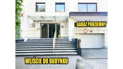 a building with a door and stairs in front of it at Apartament Lea in Kraków