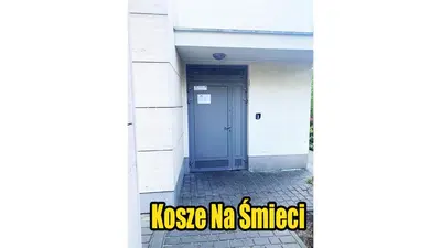 a door on a building with the textonse ko smiled at Apartament Lea in Kraków