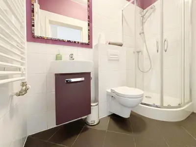 a bathroom with a toilet and a sink and a shower at Batorego loft - 5 minutes to Main Square in Kraków