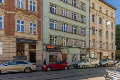 a group of cars parked in front of a building at One-Bedroom Kazimierz Apartment for Home Office Starowiślna by Noclegi Renters in Kraków