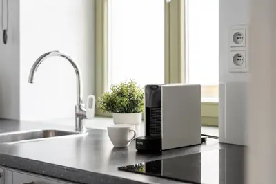 a kitchen counter with a microwave oven on a counter top at Old Town Krupnicza in Kraków