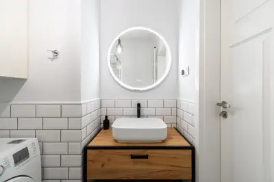 a bathroom with a sink and a mirror at Old Town Krupnicza in Kraków