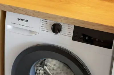 a close up of a washing machine in a room at High Apartment with a View of the Old Town by Noclegi Renters in Kraków