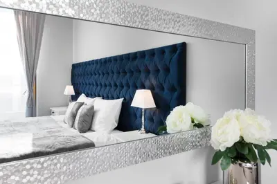 a bedroom with a bed with a blue headboard at Two-Bedroom Apartment with Living Room, Free Parking - Kazimierz in Kraków