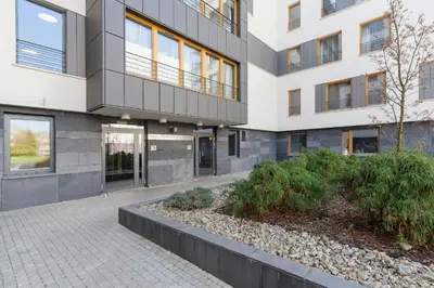 a building with a walkway in front of it at Two-Bedroom Apartment with Living Room, Free Parking - Kazimierz in Kraków