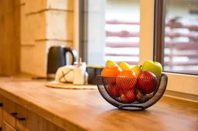 a bowl of fruit sitting on top of a counter at Domki Natura Zator in Graboszyce