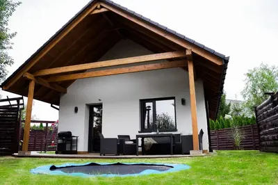 a small house with a pitched roof at Domki Natura Zator in Graboszyce