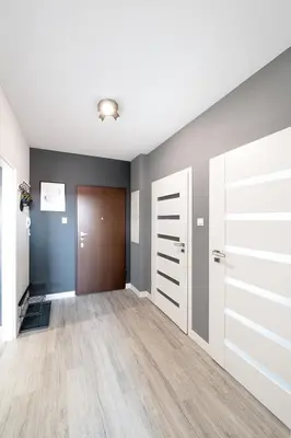 an empty room with doors and a hallway at Kaskada in Kraków